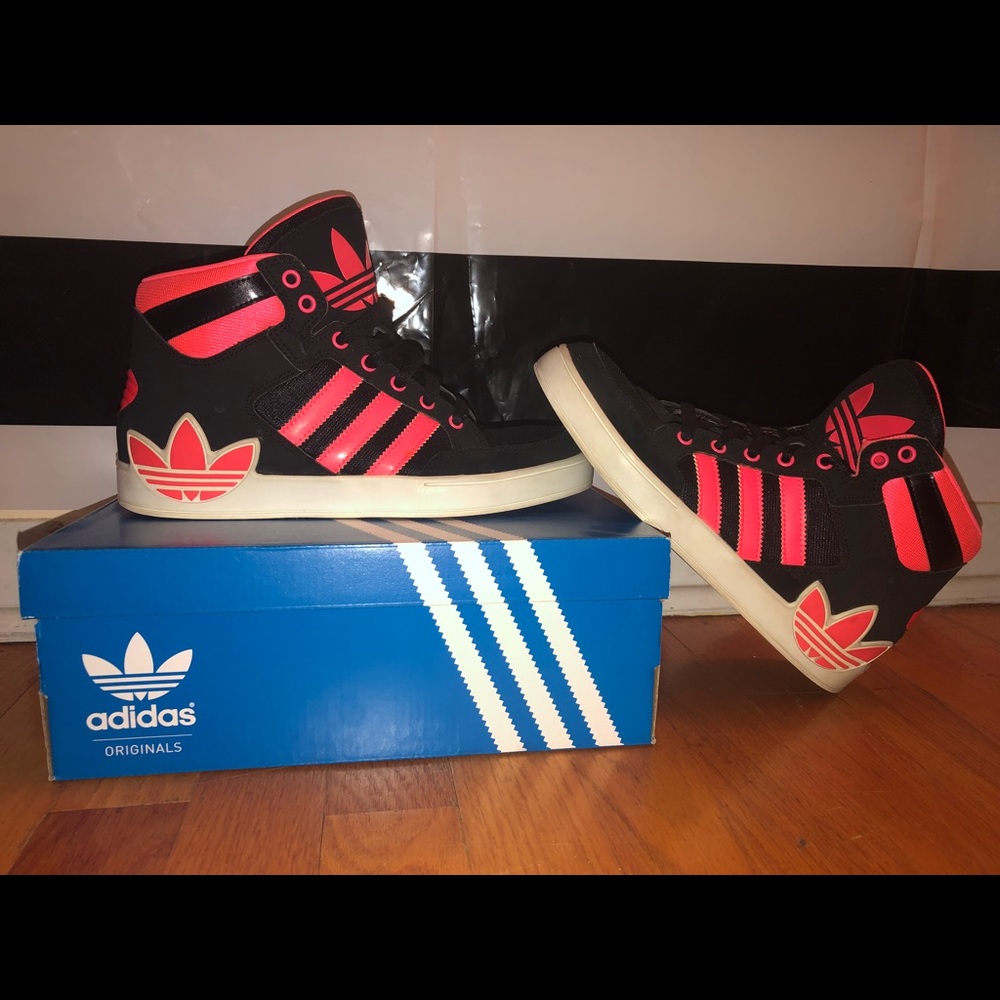 Pink and black high top adidas